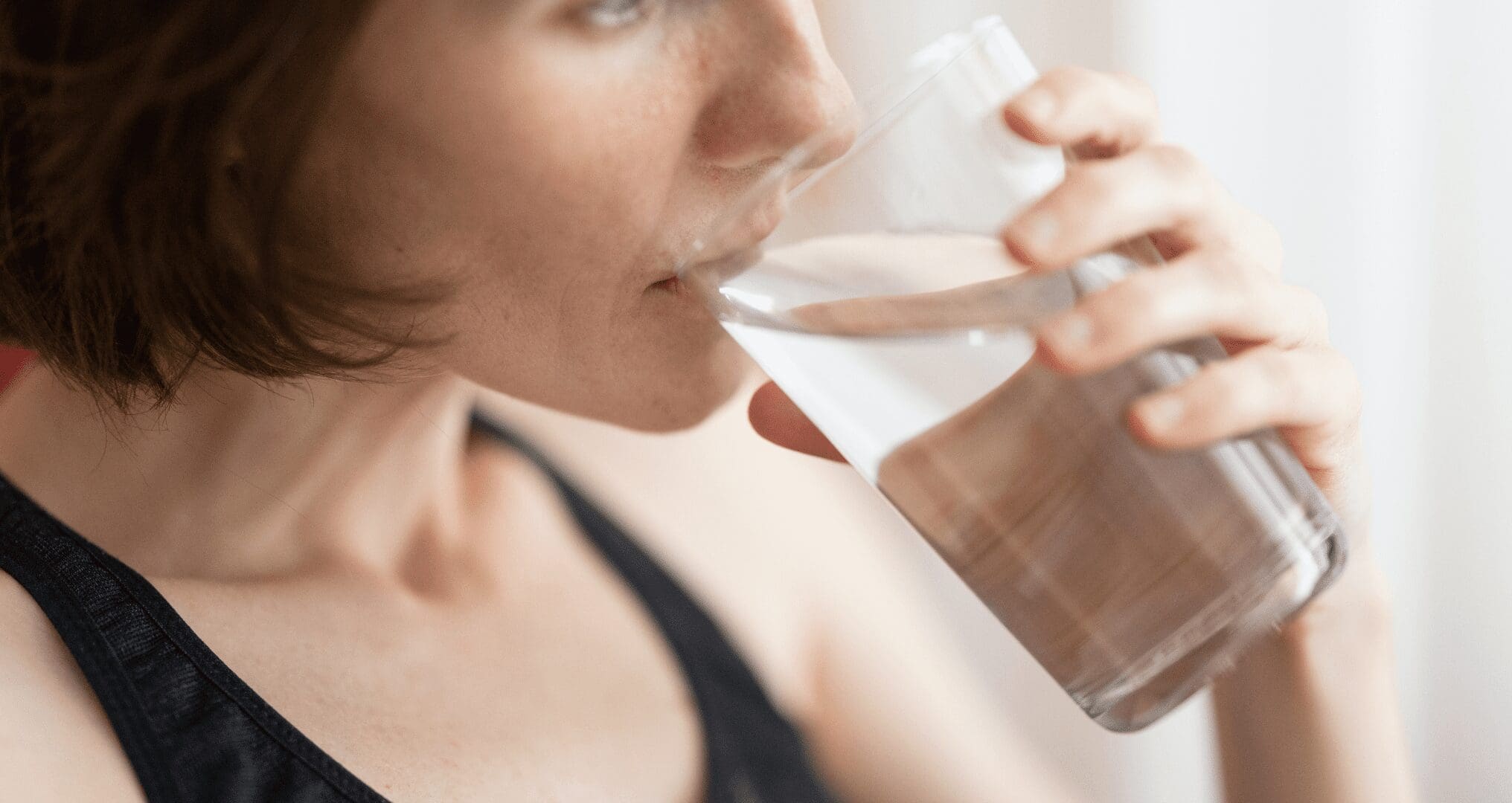 Young woman drinking water Young woman drinking water