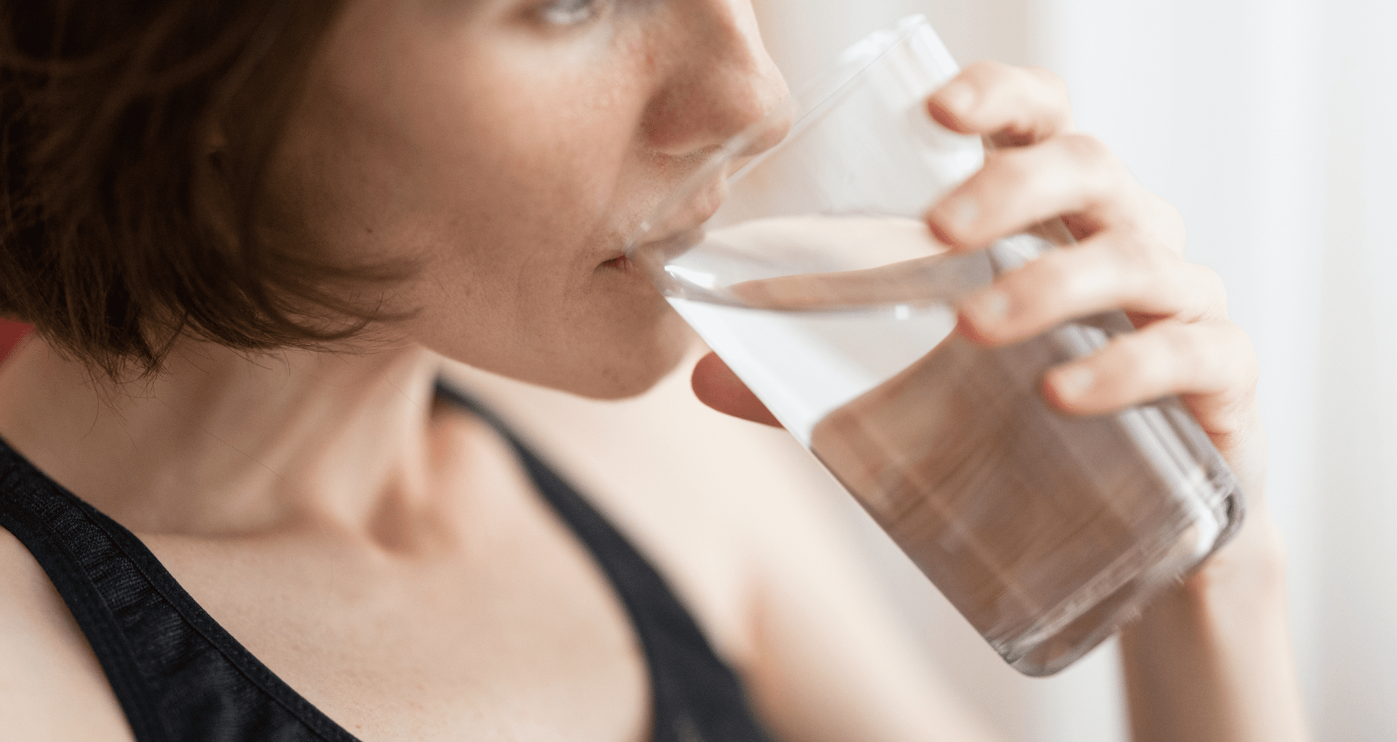 Young woman drinking water