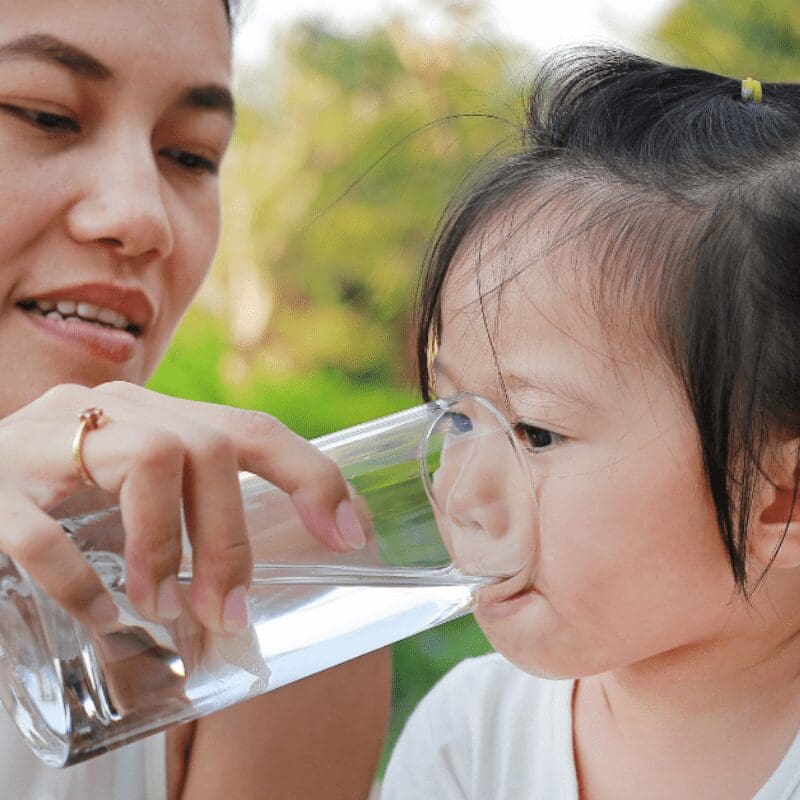 _ mom gives clean drinking water to daughter mom gives clean drinking water to daughter