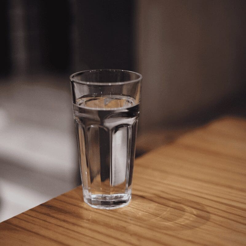 A tall glass of water. A tall glass of water.