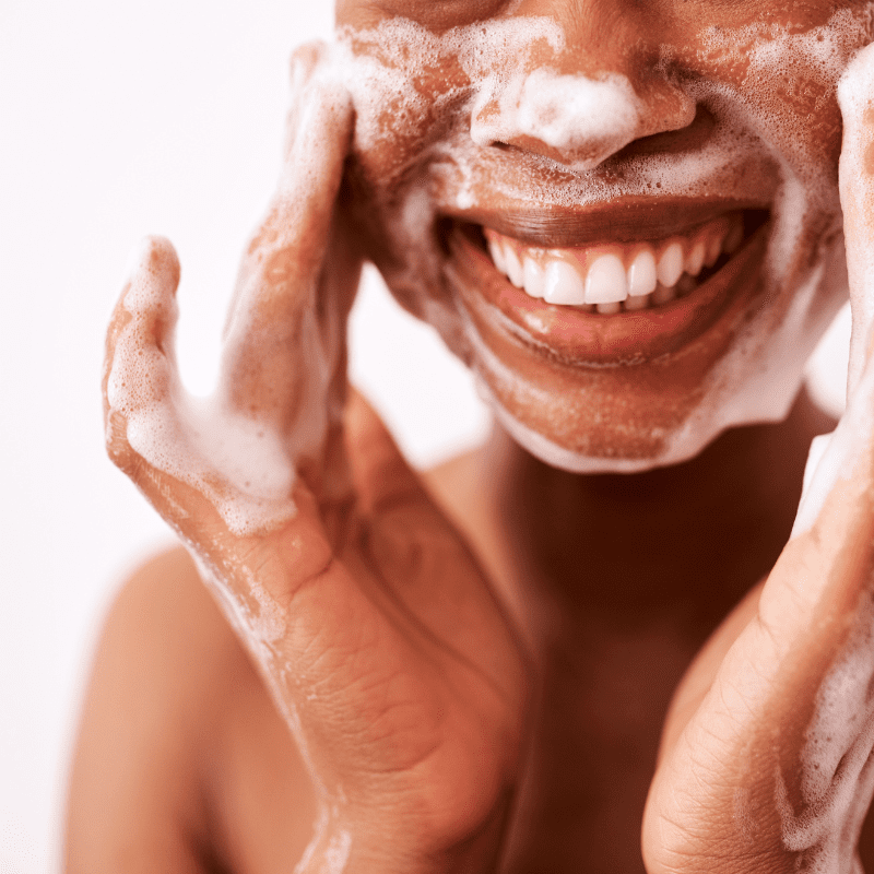 woman using exfoliating facial scrub