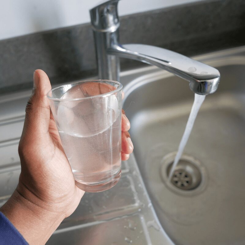 dirty water pouring from a faucet tap