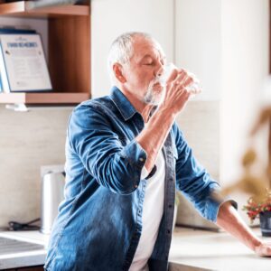 senior man drinking water