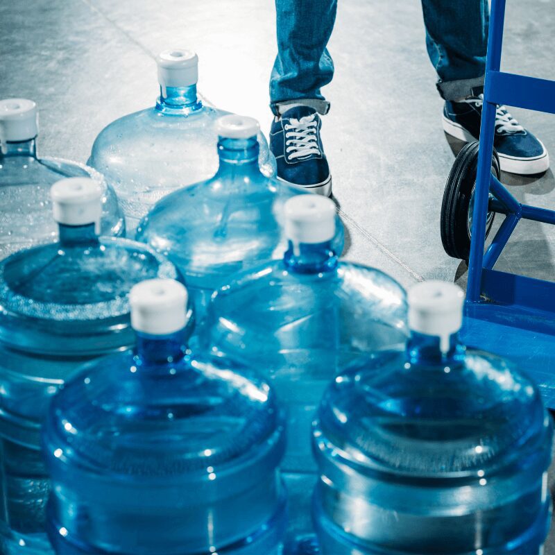 black-man-factory-worker-taking-a-break-from-work-2023-11-27-04-50-56-utc.jpg delivery of 5-gallon water jugs to workplace