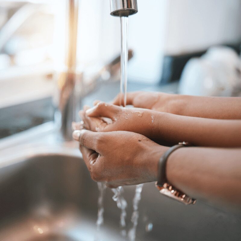 parent and child washing hands at the sink. parent and child washing hands at the sink.
