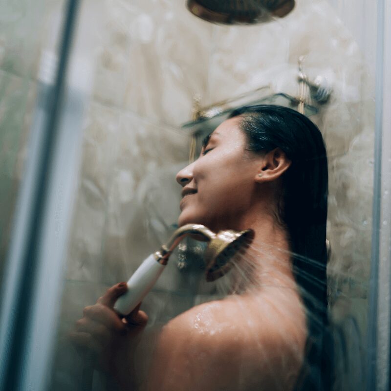 woman showering enjoying clean soft water.jpg woman showering, enjoying clean soft water