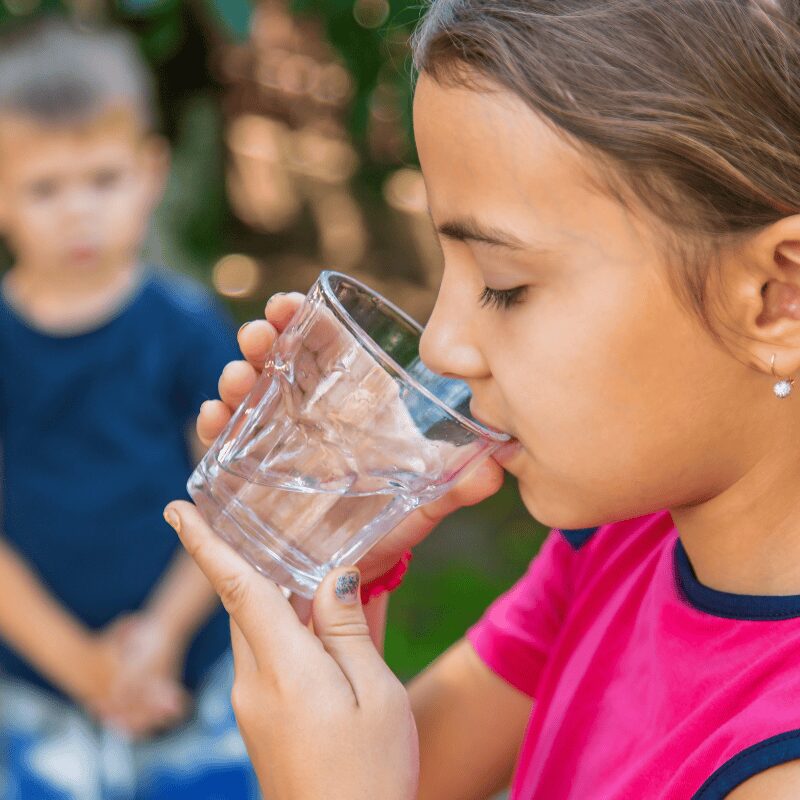 child-drinks-water-from-a-glass child drinking from water glass