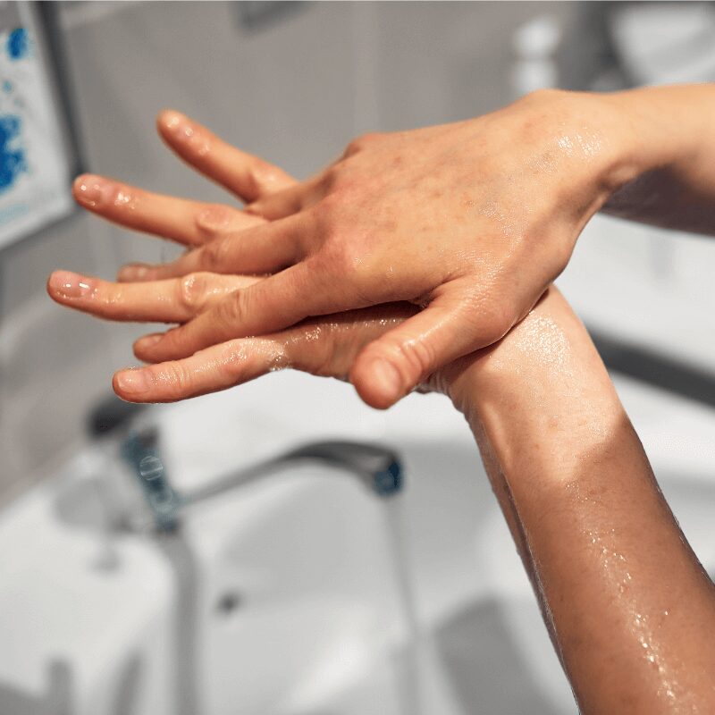 person washing their hands