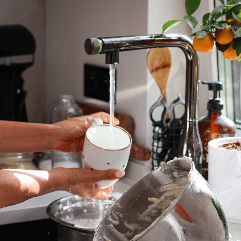 closeup of female washing dishes