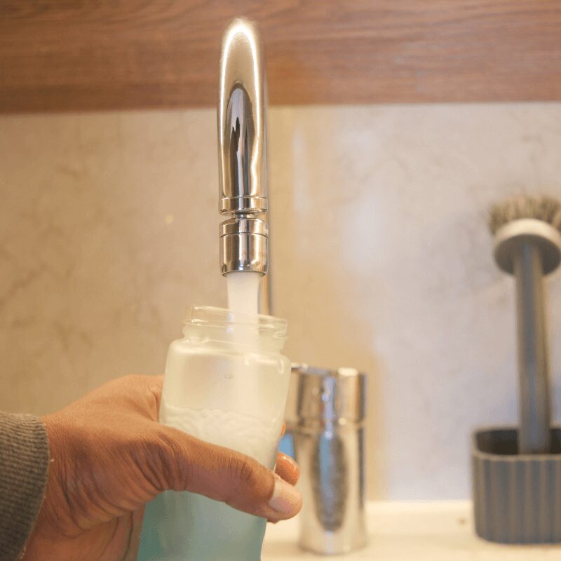 young Indiana man drinking water from a glass