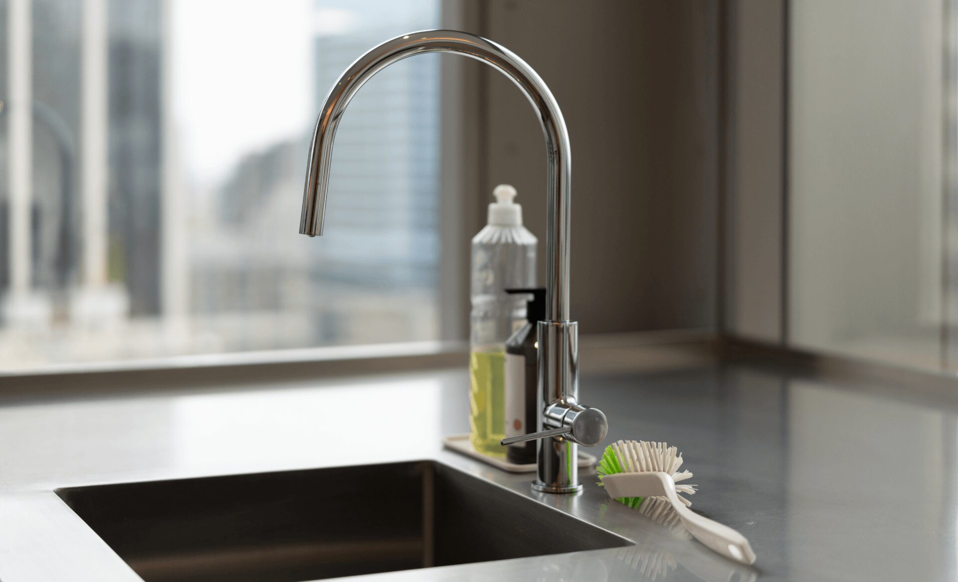 Side view of an RO water faucet at a kitchen sink