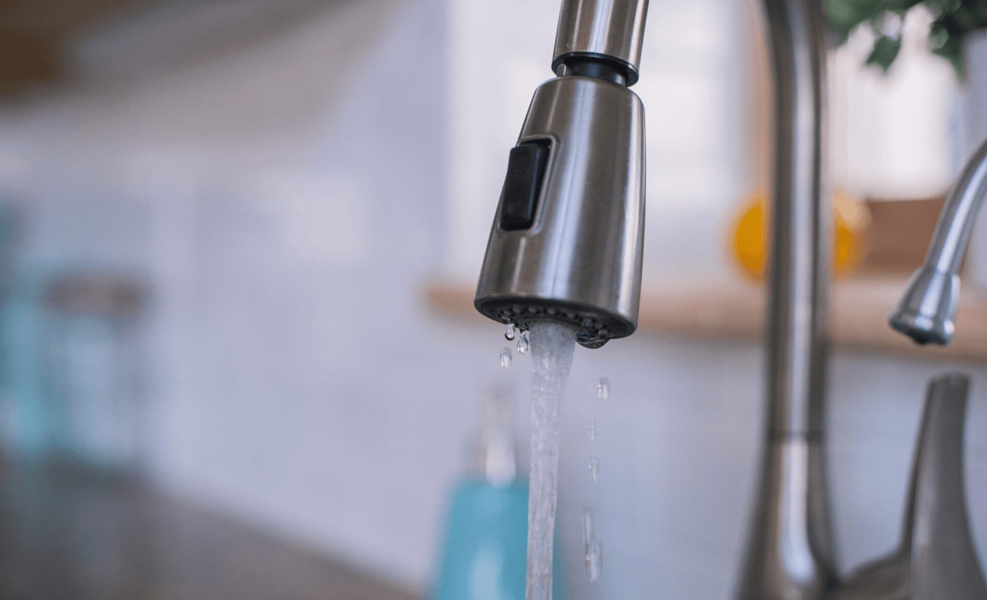 close up view of a faucet running water