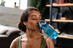woman-in-sporty-fitness-outfit-drinking-water-afte-2026-01-07-00-46-01-utc (1) woman-in-sporty-fitness-outfit-drinking-water