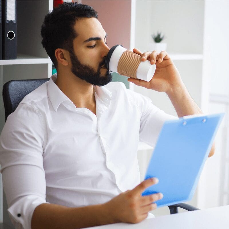 business man drinking coffee at the office